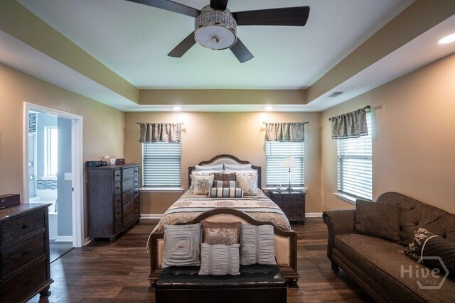 66 Tarbert Cut Cut, Richmond Hill, GA 31324 - bedroom with dark wood-style flooring, baseboards, and a raised ceiling