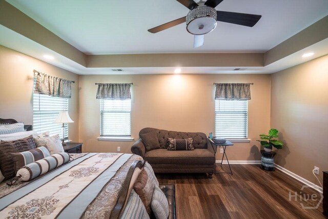 66 Tarbert Cut Cut, Richmond Hill, GA 31324 - bedroom with wood finished floors, baseboards, multiple windows, a raised ceiling, and recessed lighting