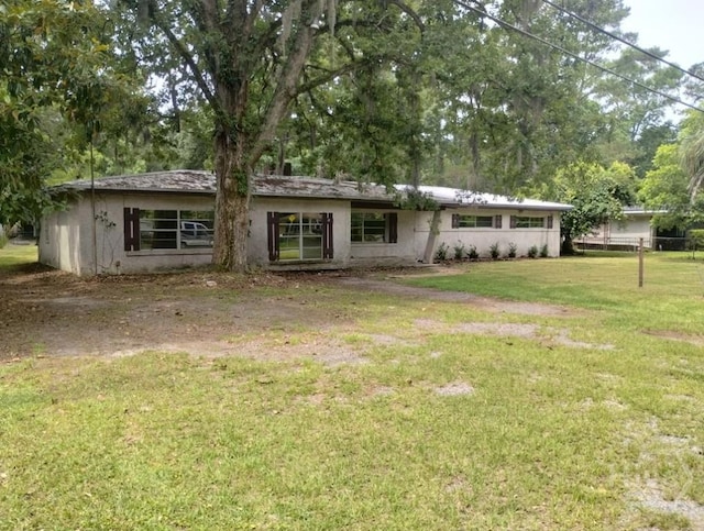 107 Lyons Rd, Pooler, GA 31322 - view of front of house with a front yard and stucco siding