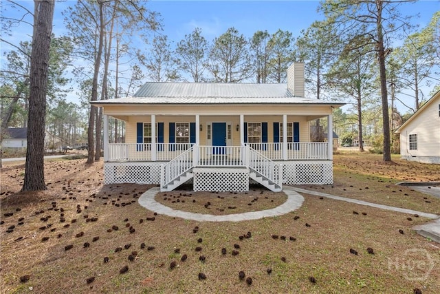 800 N Taylor Ct, Statesboro, GA 30461 - view of front facade featuring covered porch, stairway, a chimney, and metal roof