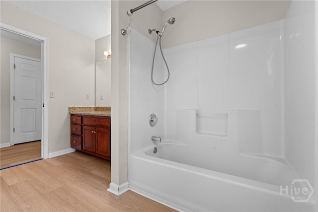800 N Taylor Ct, Statesboro, GA 30461 - full bath featuring wood finished floors, shower / washtub combination, vanity, and baseboards