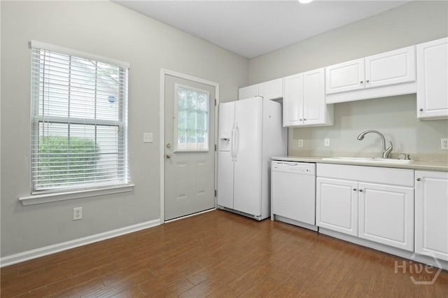 301 Morgan Pines Dr, Pooler, GA 31322 - kitchen with white appliances, a sink, light countertops, white cabinets, and dark wood-style floors