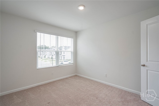147 Congo Ct, Pooler, GA 31322 - empty room featuring plenty of natural light, carpet flooring, and baseboards