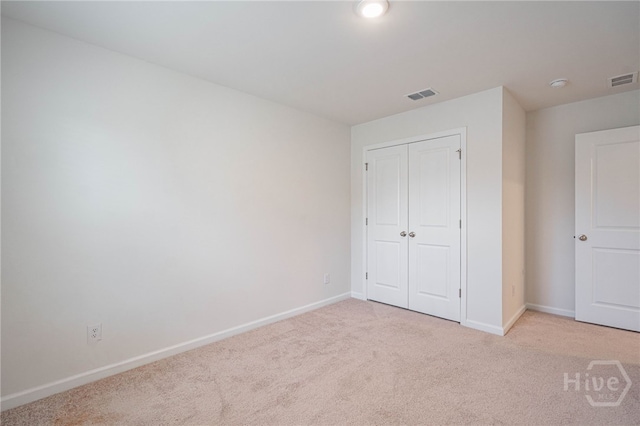147 Congo Ct, Pooler, GA 31322 - unfurnished bedroom with light colored carpet, baseboards, and a closet
