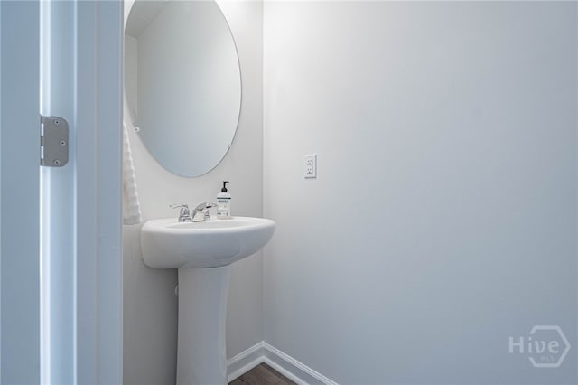 147 Congo Ct, Pooler, GA 31322 - bathroom with baseboards and wood finished floors
