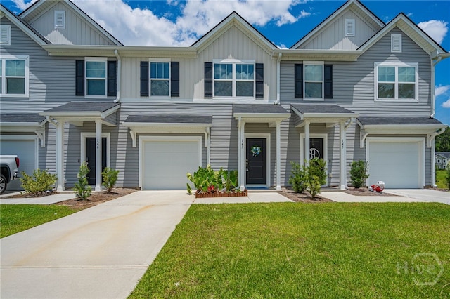 147 Congo Ct, Pooler, GA 31322 - multi unit property featuring board and batten siding, concrete driveway, an attached garage, and a front lawn