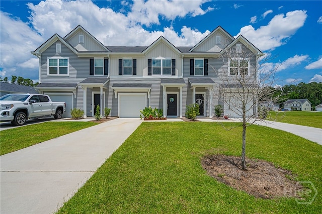 147 Congo Ct, Pooler, GA 31322 - view of front of house featuring board and batten siding, concrete driveway, a garage, and a front lawn