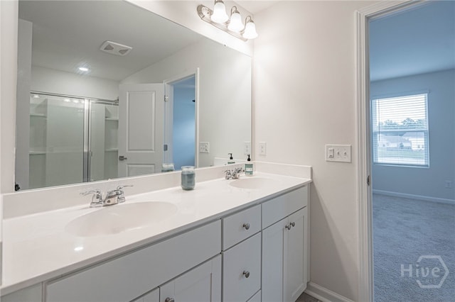 147 Congo Ct, Pooler, GA 31322 - bathroom with double vanity, baseboards, and an enclosed shower