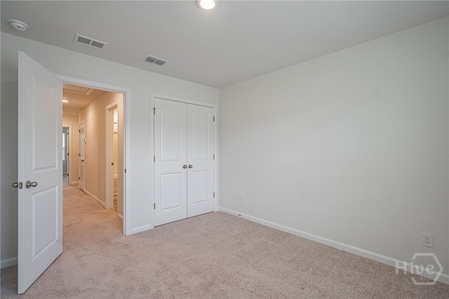147 Congo Ct, Pooler, GA 31322 - unfurnished bedroom featuring light colored carpet, baseboards, a closet, and attic access