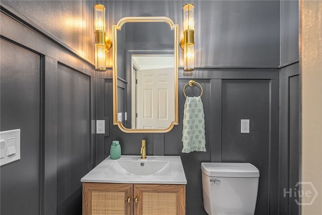 32 Sparnel Rd, Savannah, GA 31411 - half bathroom featuring vanity, toilet, and a decorative wall