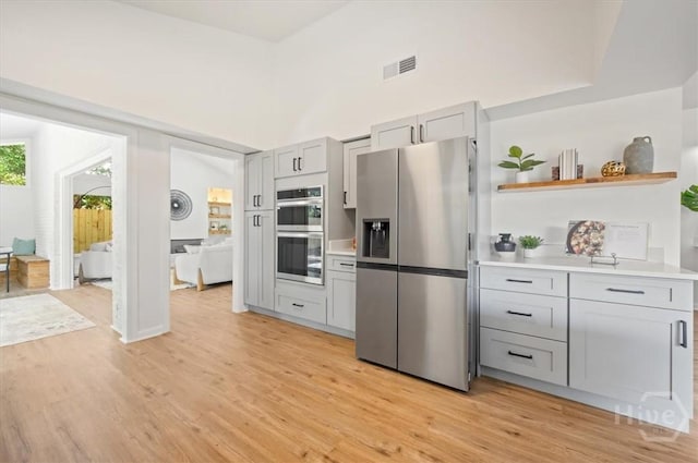 4750 Sylvan Dr, Savannah, GA 31405 - kitchen with appliances with stainless steel finishes, gray cabinetry, light wood-style flooring, and light countertops