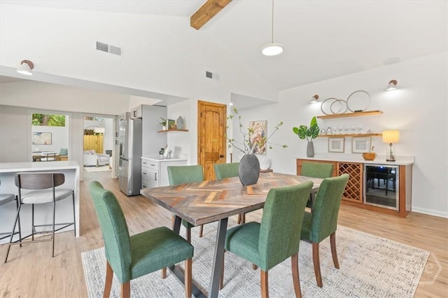 4750 Sylvan Dr, Savannah, GA 31405 - dining room featuring beverage cooler, a bar, and light wood-style flooring