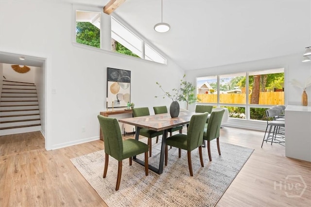 4750 Sylvan Dr, Savannah, GA 31405 - dining space featuring stairs, high vaulted ceiling, wood finished floors, beamed ceiling, and baseboards