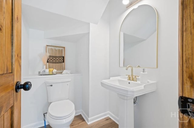 4750 Sylvan Dr, Savannah, GA 31405 - half bathroom featuring toilet, wood finished floors, and baseboards