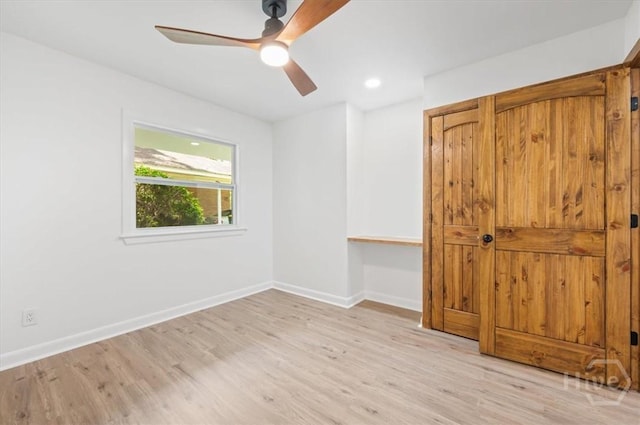 4750 Sylvan Dr, Savannah, GA 31405 - unfurnished bedroom with wood finished floors, baseboards, and ceiling fan