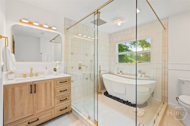 4750 Sylvan Dr, Savannah, GA 31405 - full bath with vanity, a stall shower, a soaking tub, toilet, and tile walls