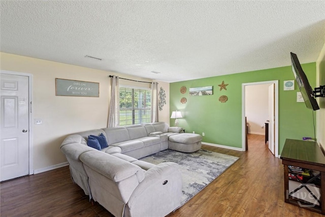 151 Ogeechee Ave, Bloomingdale, GA 31302 - living room with a textured ceiling, wood finished floors, and baseboards