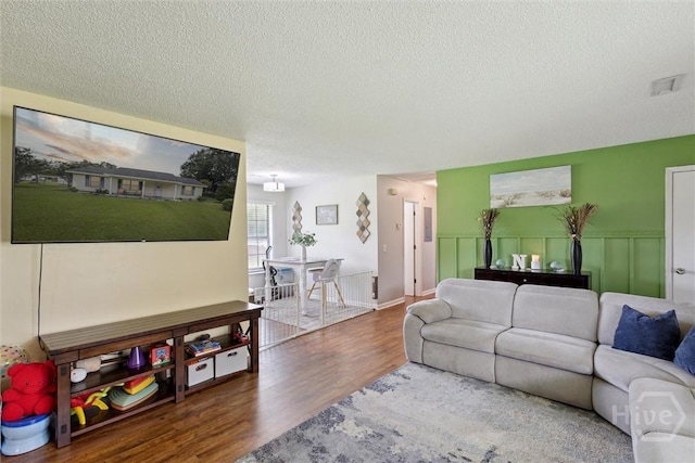 151 Ogeechee Ave, Bloomingdale, GA 31302 - living room with wood finished floors and a textured ceiling