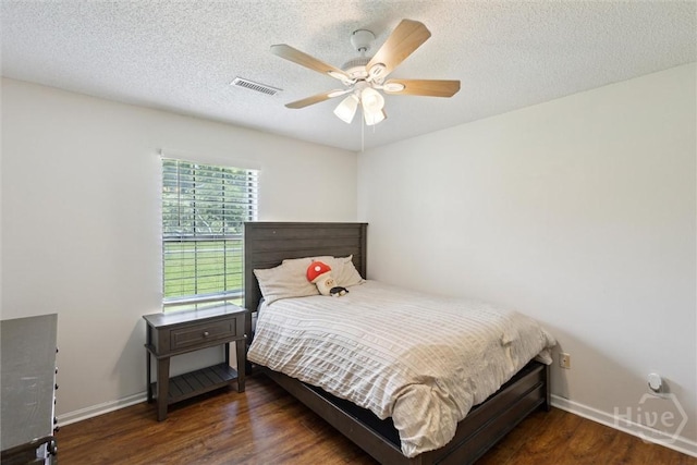 151 Ogeechee Ave, Bloomingdale, GA 31302 - bedroom with wood finished floors, baseboards, a ceiling fan, and a textured ceiling