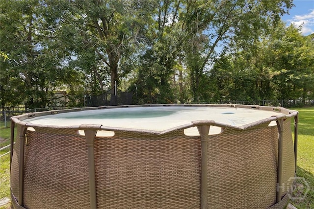 151 Ogeechee Ave, Bloomingdale, GA 31302 - view of swimming pool with view of wooded area