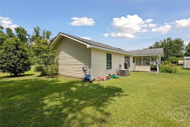 151 Ogeechee Ave, Bloomingdale, GA 31302 - rear view of house featuring central AC unit and a yard