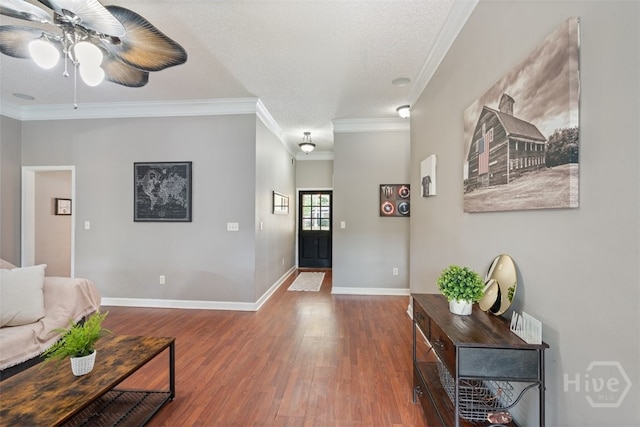 210 Pebblestone Dr, Bloomingdale, GA 31302 - foyer entrance featuring ceiling fan, wood finished floors, crown molding, baseboards, and a textured ceiling