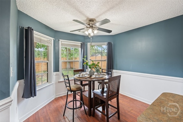 210 Pebblestone Dr, Bloomingdale, GA 31302 - dining room with wood finished floors, a ceiling fan, a textured ceiling, and plenty of natural light