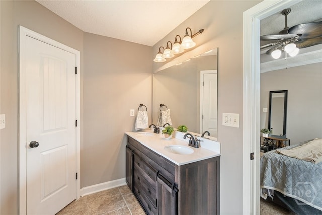 210 Pebblestone Dr, Bloomingdale, GA 31302 - ensuite bathroom featuring double vanity, baseboards, ceiling fan, and tile patterned flooring