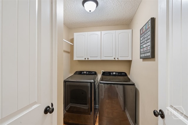 210 Pebblestone Dr, Bloomingdale, GA 31302 - laundry area with washing machine and dryer, cabinet space, and a textured ceiling