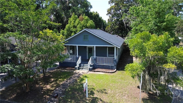 2301 Alaska St, Savannah, GA 31404 - bungalow-style house featuring covered porch and a front lawn