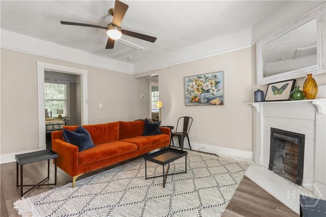 2301 Alaska St, Savannah, GA 31404 - living area featuring wood finished floors, a fireplace, and ceiling fan