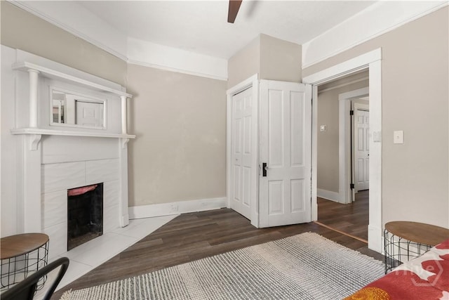 2301 Alaska St, Savannah, GA 31404 - bedroom featuring a tiled fireplace, wood finished floors, a closet, and a ceiling fan