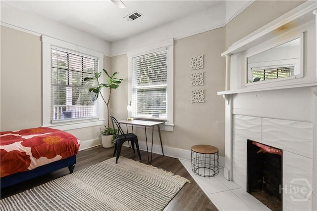 2301 Alaska St, Savannah, GA 31404 - bedroom with a fireplace and wood finished floors