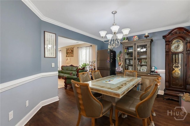 4 Broken Bit Rd, Ellabell, GA 31308 - dining room with a chandelier, ornamental molding, and dark wood-style flooring