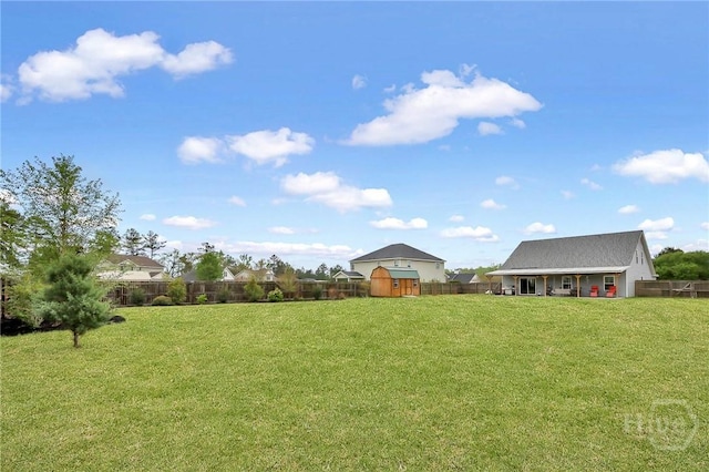4 Broken Bit Rd, Ellabell, GA 31308 - fenced backyard with a storage unit