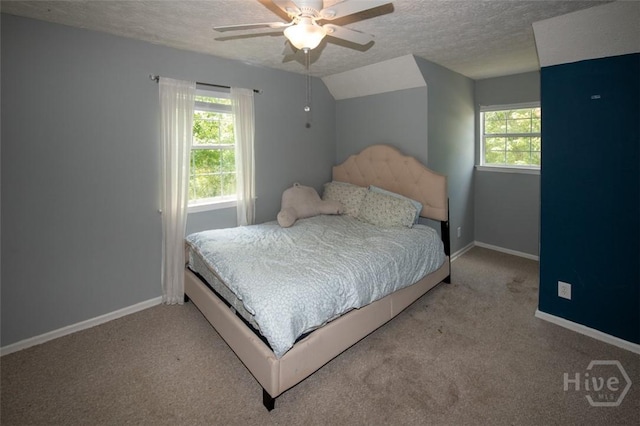 104 Ropemaker Ln, Savannah, GA 31410 - bedroom featuring a textured ceiling, carpet flooring, baseboards, vaulted ceiling, and a ceiling fan