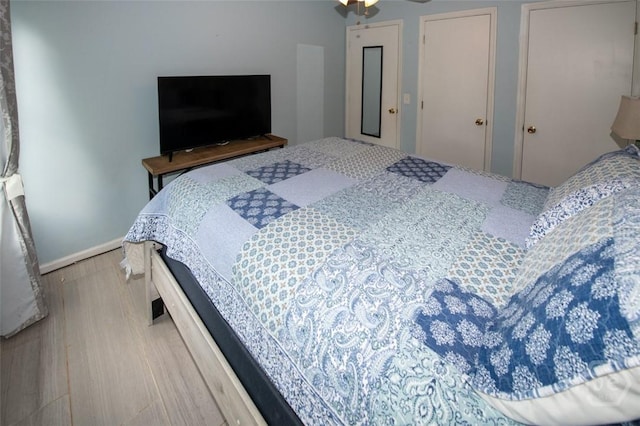 104 Ropemaker Ln, Savannah, GA 31410 - bedroom with wood finished floors, multiple closets, and baseboards
