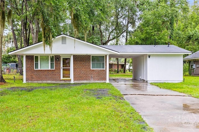 8519 Cresthill Ave, Savannah, GA 31406 - view of front of house featuring asphalt driveway, an attached carport, and brick siding