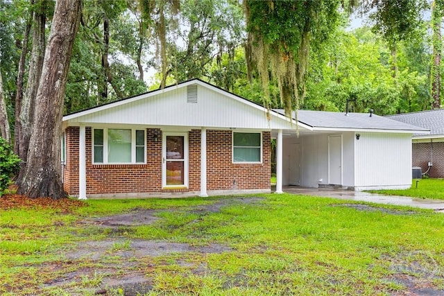 8519 Cresthill Ave, Savannah, GA 31406 - ranch-style house featuring a front yard, a carport, central AC unit, and brick siding