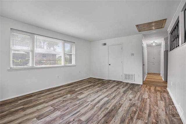 8519 Cresthill Ave, Savannah, GA 31406 - unfurnished room featuring wood finished floors and attic access
