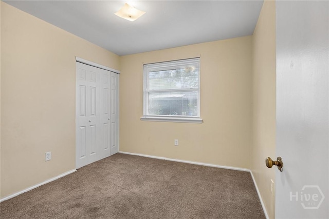 8519 Cresthill Ave, Savannah, GA 31406 - unfurnished bedroom featuring carpet floors, baseboards, and a closet