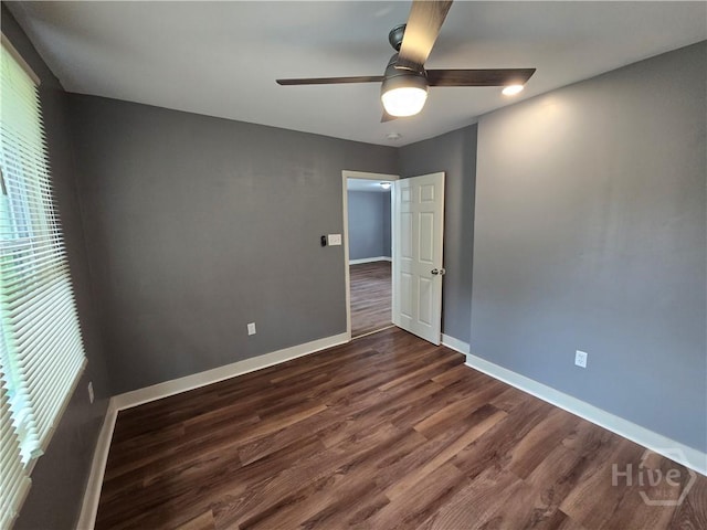 1922 Fenwick Ave, Savannah, GA 31405 - empty room with ceiling fan, dark wood-style flooring, baseboards, and healthy amount of natural light