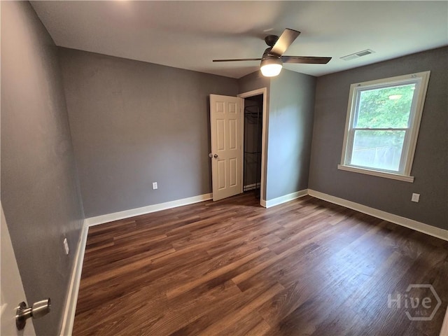 1922 Fenwick Ave, Savannah, GA 31405 - empty room featuring a ceiling fan, dark wood-style flooring, and baseboards