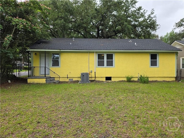 1922 Fenwick Ave, Savannah, GA 31405 - back of property featuring cooling unit, stucco siding, and roof with shingles