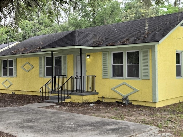 1922 Fenwick Ave, Savannah, GA 31405 - view of front of home featuring a shingled roof and stucco siding