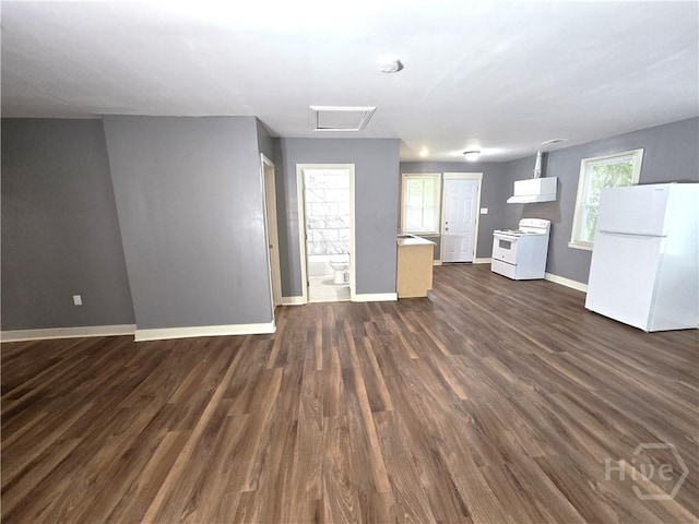 1922 Fenwick Ave, Savannah, GA 31405 - unfurnished living room with baseboards, dark wood finished floors, and attic access