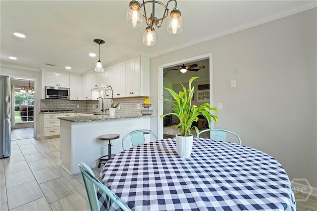 510 Braves Field Dr, Guyton, GA 31312 - dining room with crown molding, a ceiling fan, and recessed lighting