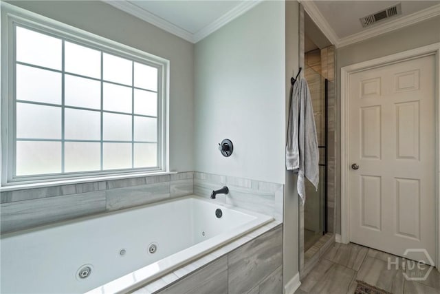 510 Braves Field Dr, Guyton, GA 31312 - bathroom with a shower stall, a jetted tub, and crown molding