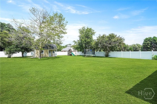 510 Braves Field Dr, Guyton, GA 31312 - view of yard featuring a trampoline and a playground