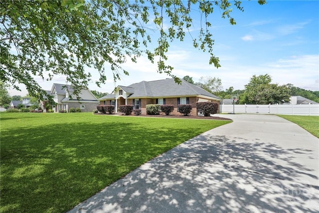 510 Braves Field Dr, Guyton, GA 31312 - single story home with concrete driveway, a garage, and brick siding